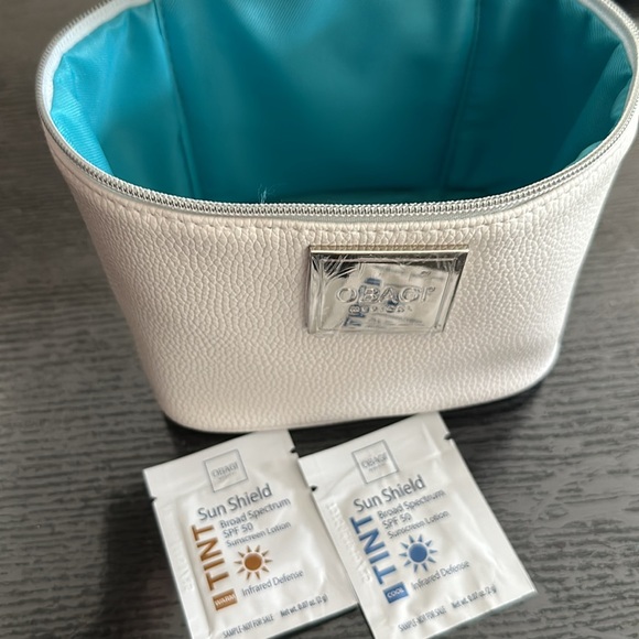 White with Tiffany blue lined Obagi cosmetics vanity bag with sunscreen samples. - Picture 2 of 2